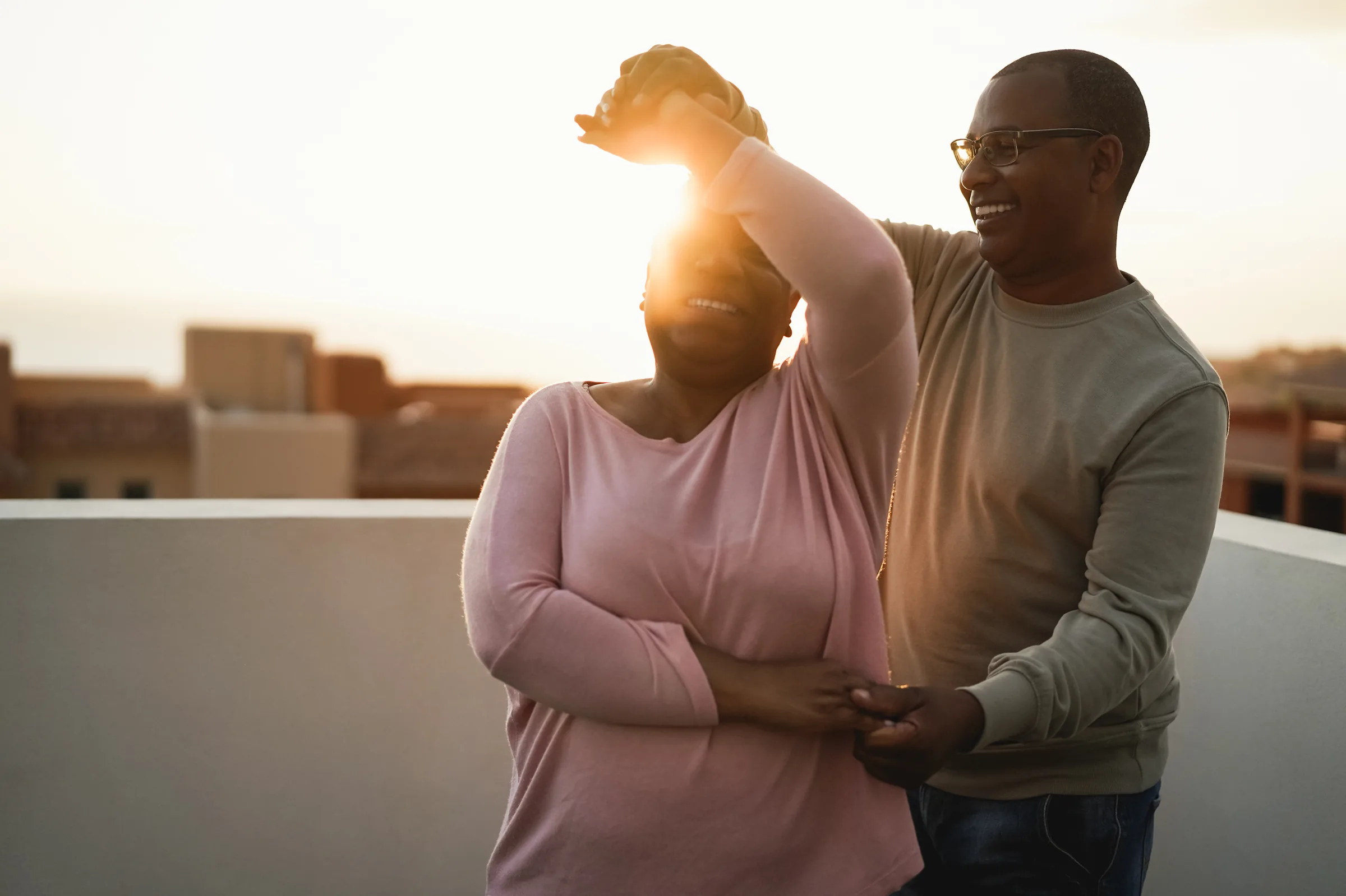 A couple dancing outdoors at sunset, habits as rhythm