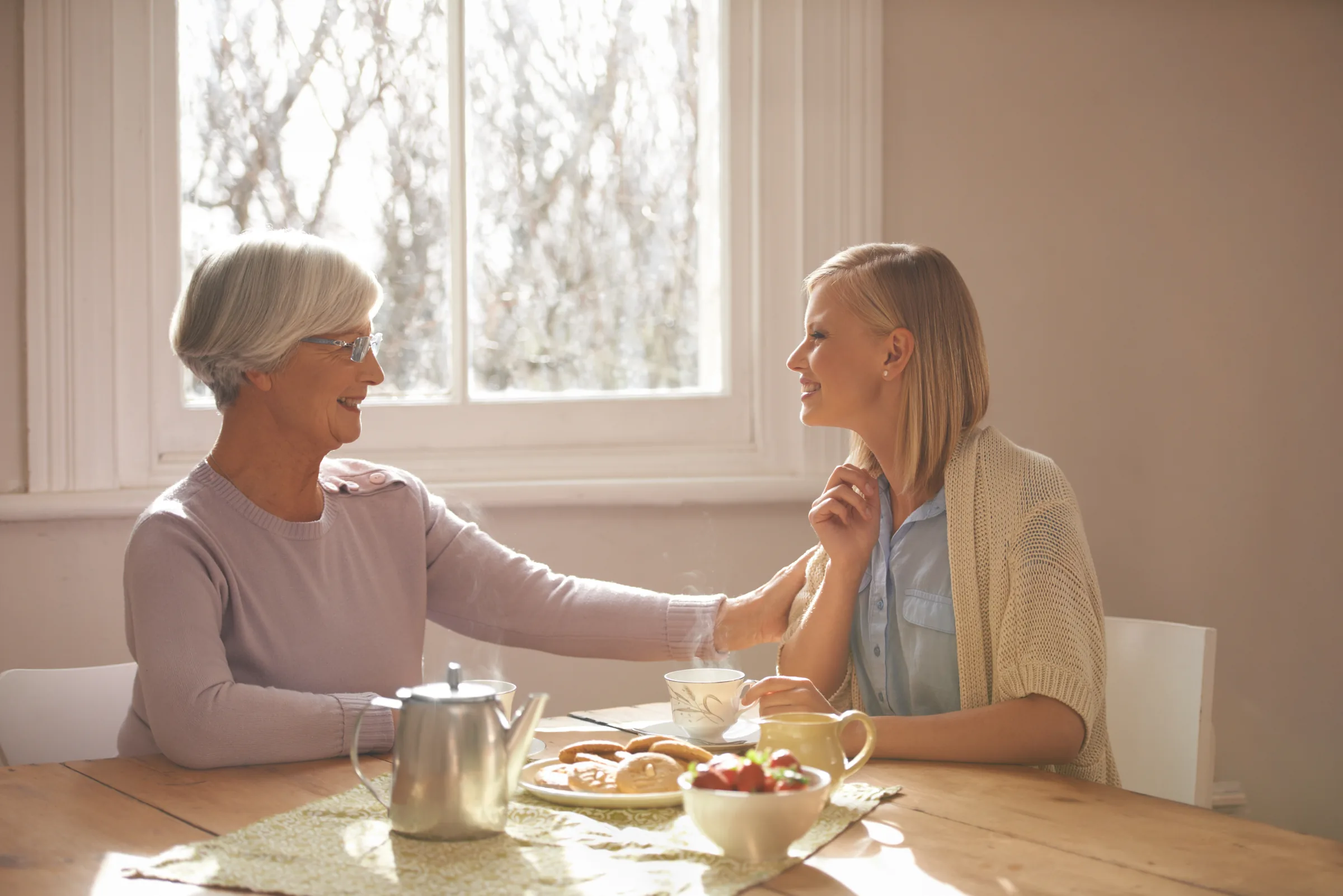 A grandmother sharing tea with family, a quiet moment at home